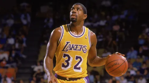 Magic Johnson #32 of the Los Angeles Lakers dribbles the ball during an NBA game at the Great Western Forum in Los Angeles, California in 1988.