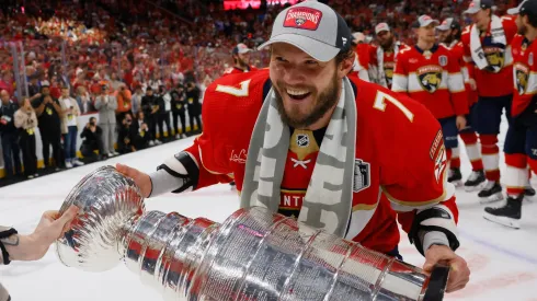 Dmitry Kulikov #7 of the Florida Panthers celebrates with the Stanley Cup following a 2-1 victory over the Edmonton Oilers in Game Seven of the 2024 NHL Stanley Cup Final.