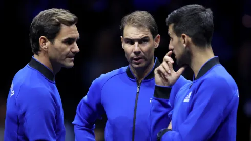 Roger Federer, Rafael Nadal and Novak Djokovic talk on centre court during the Laver Cup.