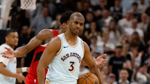 Chris Paul #3 of the San Antonio Spurs stares down Scottie Barnes #4 of the Toronto Raptors