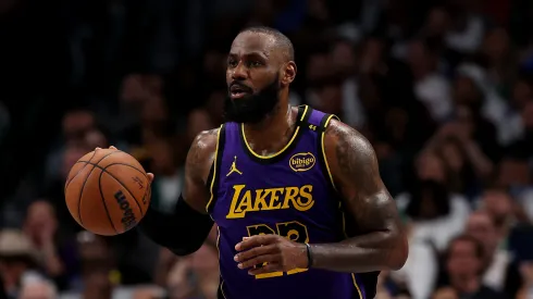 LeBron James #23 of the Los Angeles Lakers dribbles the ball against the Dallas Mavericks