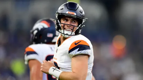 Bo Nix #10 of the Denver Broncos smiles after a touchdown during the second half of a preseason game against the Indianapolis Colts at Lucas Oil Stadium on August 11, 2024.
