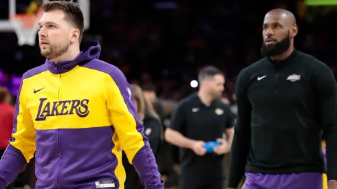 Luka Doncic #77 and LeBron James #23 of the Los Angeles Lakers warms up prior to the game against the Minnesota Timberwolves in Game One of the NBA Playoffs.