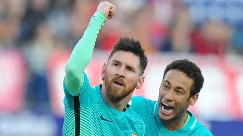 Lionel Messi celebrates with Neymar after scoring a goal during the La Liga match between Atletico de Madrid and Barcelona on February 26, 2017
