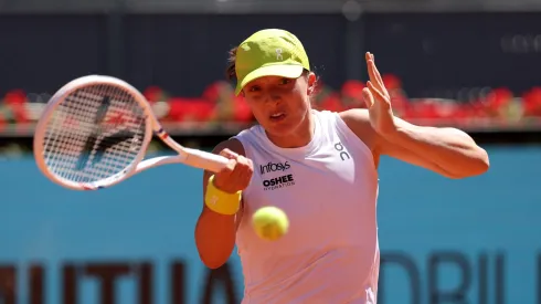 Iga Swiatek of Poland plays a forehand against Alexandra Eala of Philippines in the Women's Singles Second Round match during Day Three of the Mutua Madrid Open at La Caja Magica on April 24, 2025 in Madrid, Spain.