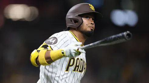 Luis Arraez #4 of the San Diego Padres reacts after hitting a solo homerun during the eighth inning of a game against the Chicago Cubs.