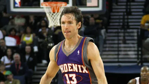 Steve Nash #13 of the Phoenix Suns dribbles the ball against the Golden State Warriors during an NBA game