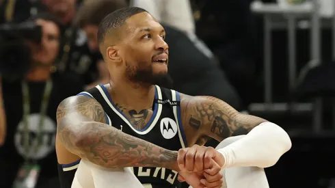 Damian Lillard #0 of the Milwaukee Bucks reacts from the court after an apparent injury during the first quarter in Game Four of the Eastern Conference First Round NBA Playoffs against the Indiana Pacers