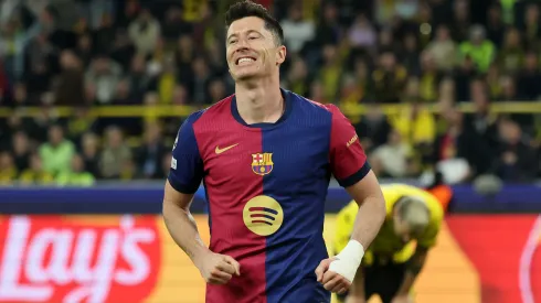 Robert Lewandowski of FC Barcelona celebrates after Ramy Bensebaini of Borussia Dortmund concedes an own goal during the Champions League.