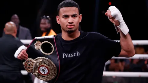 Rolando Romero poses after defeating Ismael Barroso for a vacant WBA super lightweight title at The Cosmopolitan of Las Vegas on May 13, 2023.