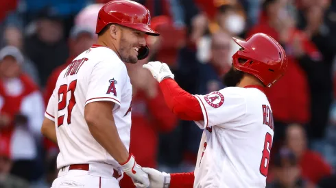 Mike Trout #27 celebrates after his teammate hits a two-run home run against the Miami Marlins during the sixth inning at Angel Stadium of Anaheim on April 12, 2022 in Anaheim, California.