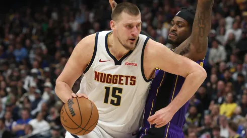 Nikola Jokic #15 of the Denver Nuggets drives against Jarred Vanderbilt #2 of the Los Angeles Lakers in the third quarter at Ball Arena on February 22, 2025 in Denver, Colorado.