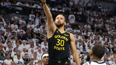 Stephen Curry #30 of the Golden State Warriors takes a shot against Mike Conley #10 of the Minnesota Timberwolves during the first quarter in Game One of the Western Conference Second Round NBA Playoffs