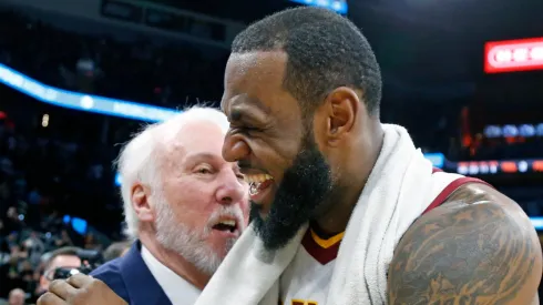 LeBron James #23 of the Cleveland Cavaliers is congratulated by Gregg Popovich head coach of the San Antonio Spurs at the end of the game at AT&T Center on January 23, 2018 in San Antonio, Texas.