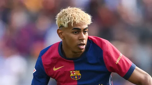 Lamine Yamal of FC Barcelona runs with the ball during the LaLiga match between FC Barcelona and Real Madrid CF at Estadi Olimpic Lluis Companys
