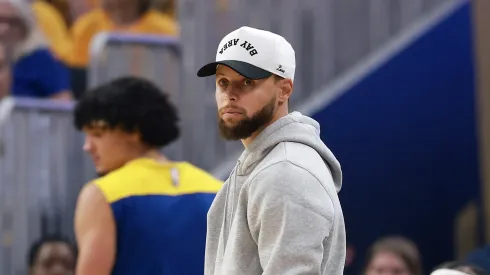 Stephen Curry #30 of the Golden State Warriors looks on from the bench during the first quarter against the Minnesota Timberwolves in Game Three of the Western Conference Second Round NBA Playoffs