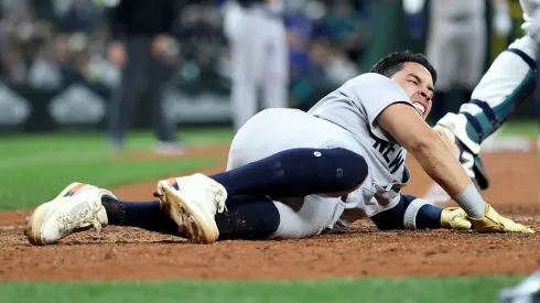 Oswaldo Cabrera #95 of the New York Yankees scores a run against the Seattle Mariners during the ninth inning but injures himself at T-Mobile Park on May 12, 2025 in Seattle, Washington.