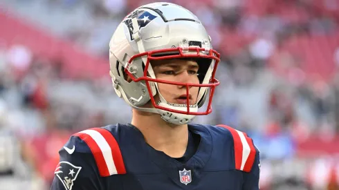 Drake Maye #10 of the New England Patriots walks the field prior to the game against the Arizona Cardinals at State Farm Stadium on December 15, 2024 in Glendale, Arizona.
