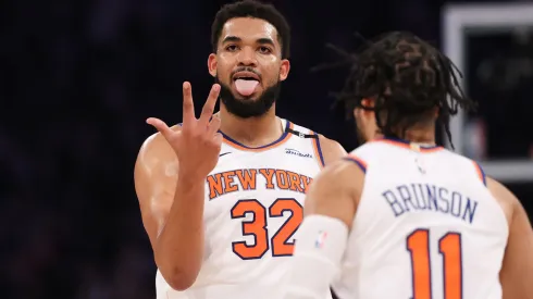 Karl-Anthony Towns and Jalen Brunson of the New York Knicks celebrate a three-point basket vs the Boston Celtics in Game 6.