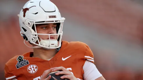 Arch Manning #16 of the Texas Longhorns warms up before the Playoff First Round Game against the Clemson Tigers at Darrell K Royal-Texas Memorial Stadium on December 21, 2024 in Austin, Texas.