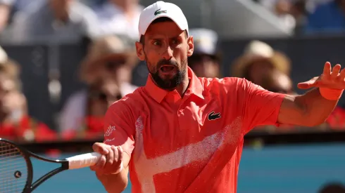 Novak Djokovic plays a forehand during the Madrid Open