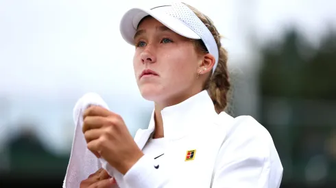 Mirra Andreeva looks on during a break between sets as she plays against Brenda Fruhvirtova of Czechia in her Ladies' Singles first round match on day one of The Championships Wimbledon 2024.