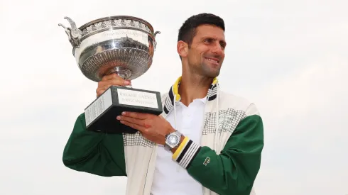 Novak Djokovic poses with the trophy after winning the title in the 2023 French Open