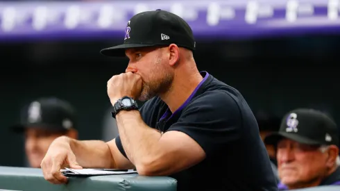 DENVER, CO – MAY 19: Interim Manager Warren Schaeffer #34 of the Colorado Rockies looks on from the bench in the first inning against the Philadelphia Phillies at Coors Field on May 19, 2025 in Denver, Colorado.
