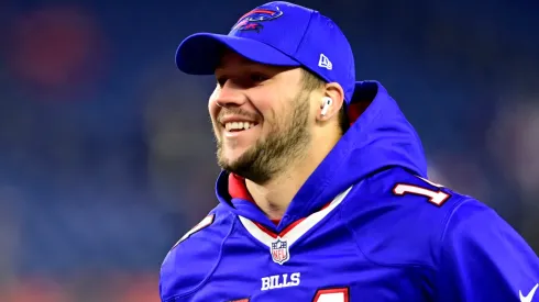Quarterback Josh Allen #17 of the Buffalo Bills wears the jersey of teammate wide receiver Stefon Diggs #14 during warms up before the start of the Bills and New England Patriots game at Gillette Stadium on December 01, 2022 in Foxborough, Massachusetts.