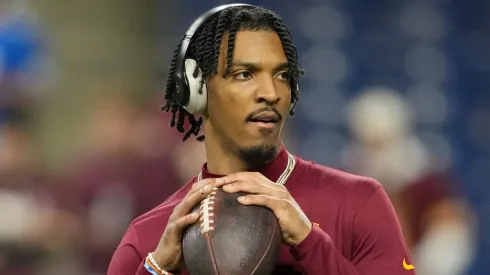 Jayden Daniels #5 of the Washington Commanders warms up prior to playing the Detroit Lions in the NFC Divisional Playoff at Ford Field on January 18, 2025 in Detroit, Michigan.