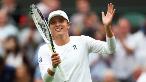 Iga Swiatek of Poland celebrates winning match point against Lin Zhu of People's Republic of China in the Women's Singles first round match during day one of The Championships Wimbledon 2023.