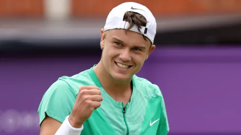 Holger Rune of Denmark celebrates winning match point against Maxime Cressy of United States during their Men's Singles First Round match on Day Two of the cinch Championships in 2023.