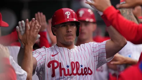 J.T. Realmuto #10 of the Philadelphia Phillies high-fives teammates after hitting a two-run home run in the bottom of the first inning against the St. Louis Cardinals during game two of a doubleheader at Citizens Bank Park on May 14, 2025 in Philadelphia, Pennsylvania.