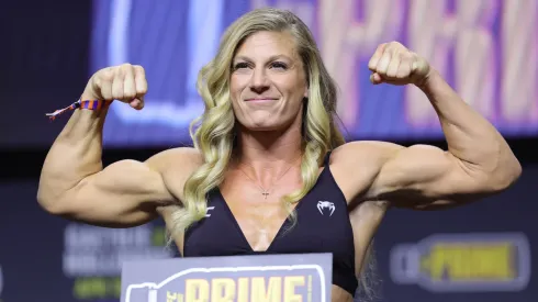 Kayla Harrison poses ont eh scale during the UFC 300 ceremonial weigh-in at MGM Grand Garden Arena on April 12, 2024 in Las Vegas, Nevada.