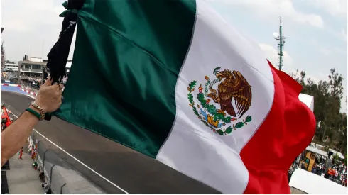 A fan waves a Mexican flag