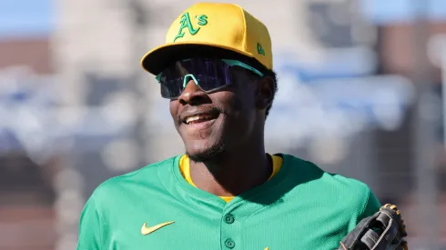 Denzel Clarke #16 of the Athletics smiles as he runs to the dugout after he made two catches on fly balls in the seventh inning, including one hit by Ryan Waldschmidt # 21 of the Arizona Diamondbacks to the center field wall, during a spring training game at Las Vegas Ballpark on March 09, 2025 in Las Vegas, Nevada. The Diamondbacks defeated the Athletics 7-5.