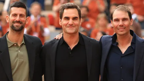 Rafael Nadal poses for a photo with Roger Federer and Novak Djokovic on Court Philippe-Chatrier.