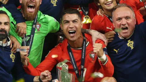 Cristiano Ronaldo and team mates of Portugal pose for a photo with the UEFA Nations League trophy after their victory in the UEFA Nations League 2025 final match between Portugal and Spain