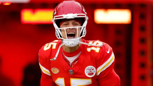 Patrick Mahomes #15 of the Kansas City Chiefs runs onto the field before the game against the Cincinnati Bengals at GEHA Field at Arrowhead Stadium on December 31, 2023 in Kansas City, Missouri.