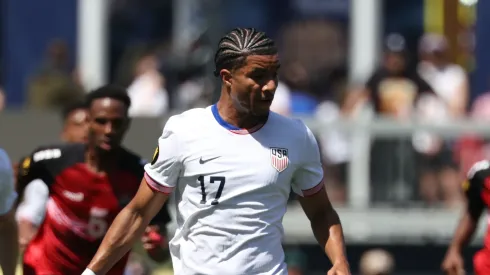 Malik Tillman #17 of United States of United States in action against Wayne Frederick II #14 of Trinidad and Tobago in the first half during the Gold Cup 2025
