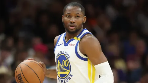 Jonathan Kuminga #00 of the Golden State Warriors handles the ball during the NBA game at PHX Arena on April 08, 2025 in Phoenix, Arizona.