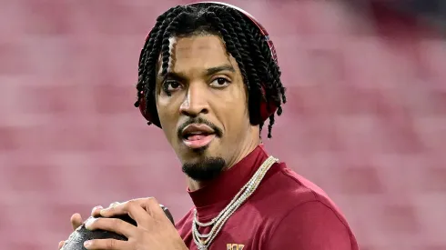 Jayden Daniels #5 of the Washington Commanders warms up prior to the NFC Wild Card Playoff against the Tampa Bay Buccaneers at Raymond James Stadium on January 12, 2025 in Tampa, Florida.