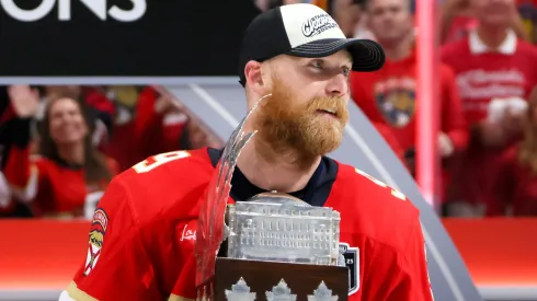 Sam Bennett #9 of the Florida Panthers celebrates with the Conn Smythe Trophy after defeating the Edmonton Oilers in Game Six of the 2025 Stanley Cup Final at Amerant Bank Arena on June 17, 2025 in Sunrise, Florida.