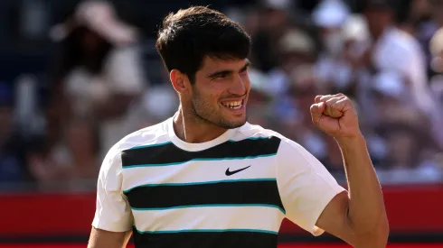 Carlos Alcaraz of Spain celebrates winning match point against Roberto Bautista Agut at Queen's Club.