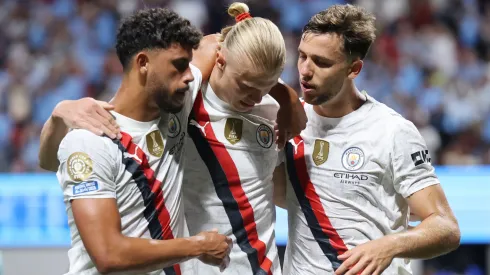 Erling Haaland #9 of Manchester City celebrates scoring his team's third goal with Matheus Nunes #27 and Nico Gonzalez #14 during the FIFA Club World Cup 2025 group G match.