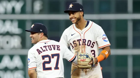 Jose Altuve #27 and Jeremy Peña #3 of the Houston Astros celebrate after their team defeated the New York Mets 3-1 on Opening Day at Daikin Park on March 27, 2025 in Houston, Texas.