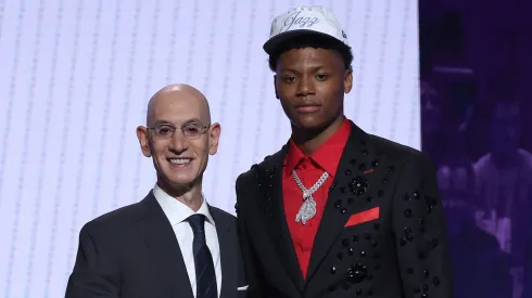 Ace Bailey (R) shakes hands with NBA commissioner Adam Silver (L) after being drafted fifth overall by the Utah Jazz during the first round of the 2025 NBA Draft at Barclays Center on June 25, 2025.