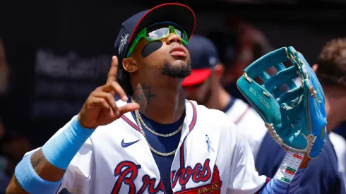 Ronald Acuña Jr. #13 of the Atlanta Braves come out of the dugout during the first inning against the Colorado Rockies at Truist Park on June 15, 2025 in Atlanta, Georgia.