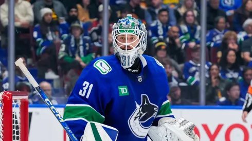 Arturs Silovs #31 of the Vancouver Canucks in net during the second period of their NHL game against the Calgary Flames at Rogers Arena on October 9, 2024 in Vancouver, British Columbia, Canada.
