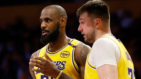 LeBron James #23 and Luka Doncic #77 of the Los Angeles Lakers talk during the third quarter of a game against the Utah Jazz.